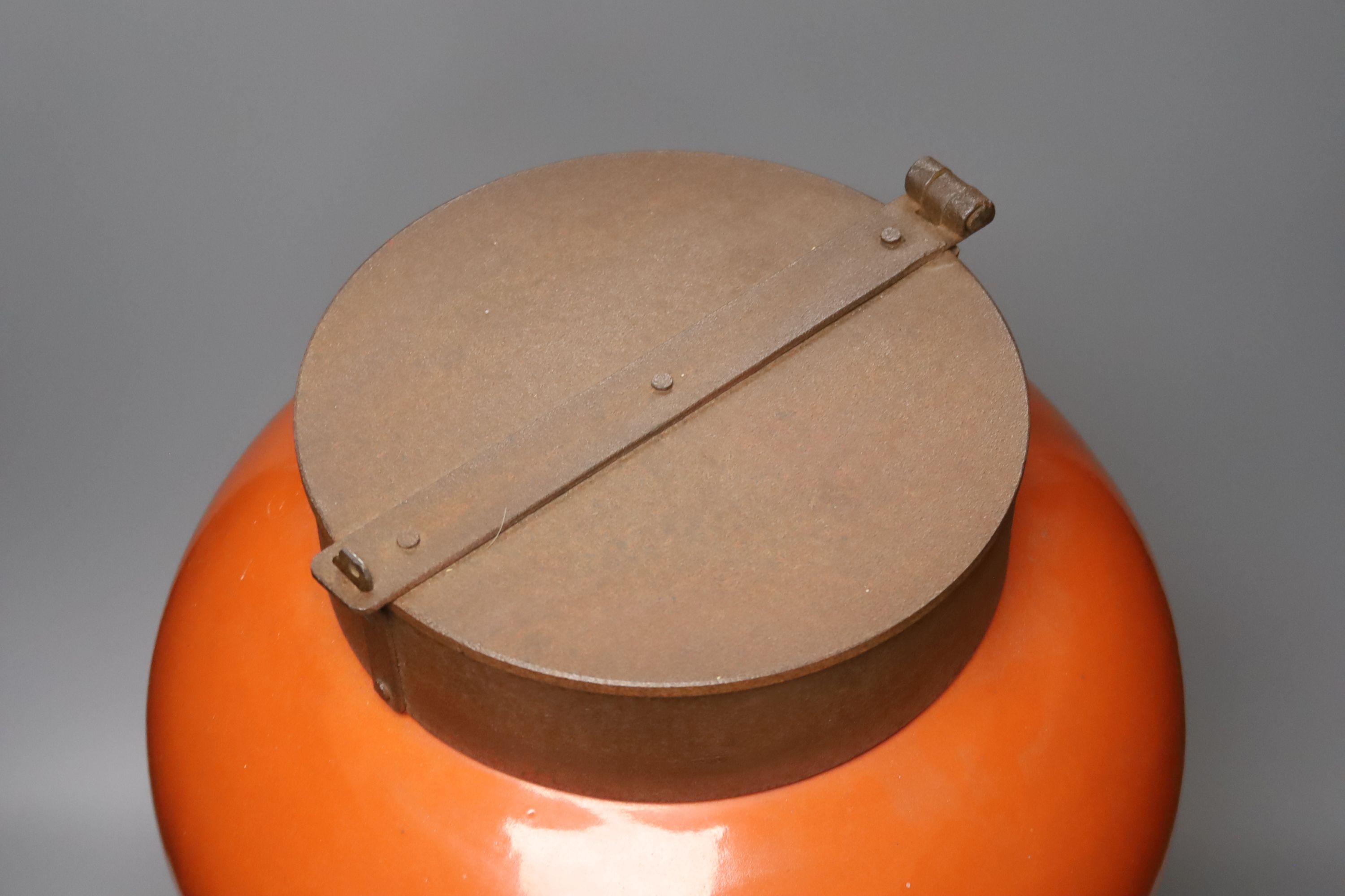 A large orange porcelain vase of shouldered form with applied iron cap 52cm